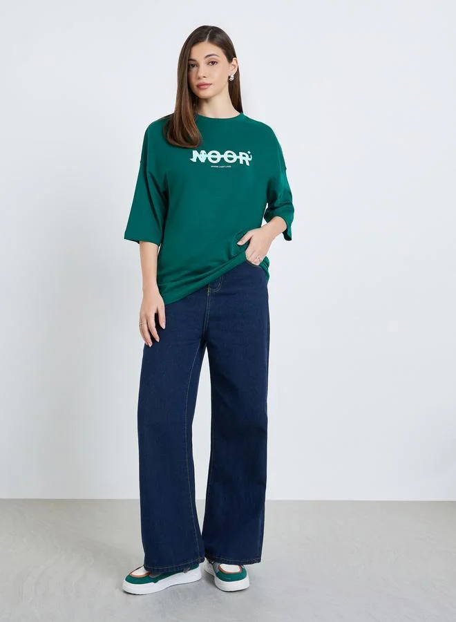 Styli Women Dark Green Slogan Print Oversized T-Shirt